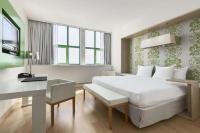 Een bed of bedden in een kamer bij NH Amsterdam Noord