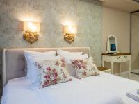 Postel nebo postele na pokoji v ubytování Paradise Center Premium Suite 1