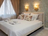 Postel nebo postele na pokoji v ubytování Paradise Center Premium Suite 1