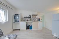 a kitchen with white cabinets and a counter top at HALTE 3 &#47; GUÈS DE VEIGNE in Veigné