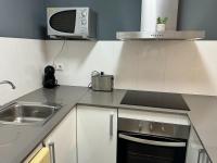 A kitchen or kitchenette at APARTAMENTO ROMELIA bajo A