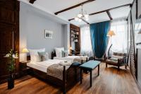 Łóżko lub łóżka w pokoju w obiekcie Baron Boutique Hotel