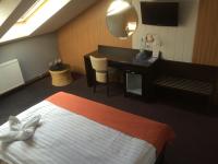 Postel nebo postele na pokoji v ubytování Hotel Slavie