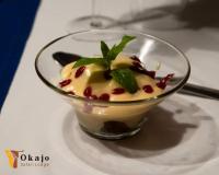 a dessert in a glass bowl on a plate at Okajo Safari Lodge in Wilhelmstal