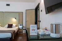 A bed or beds in a room at Hotel Buonconsiglio