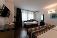 A bed or beds in a room at Hotel Buonconsiglio
