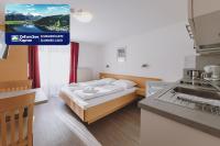 Łóżko lub łóżka w pokoju w obiekcie Appartements Sulzer by we rent, SUMMERCARD INCLUDED