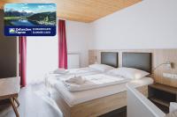 Łóżko lub łóżka w pokoju w obiekcie Appartements Sulzer by we rent, SUMMERCARD INCLUDED