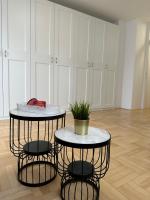 two tables and two stools in a room at Mila’s place in Zagreb