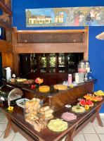 a table with many different types of food on it at Hotel Pousada Marambaia in Arraial d'Ajuda