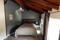 Łóżko lub łóżka w pokoju w obiekcie Gîte du Louvanto