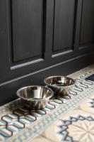 two metal bowls sitting on a table in front of a door at L&#39;Orée du Faubourg - VENDOME CENTRE in Vendôme