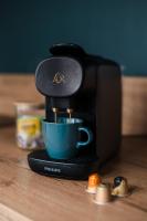 a coffee maker is making a cup of coffee at L&#39;Orée du Faubourg - VENDOME CENTRE in Vendôme