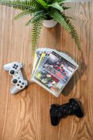 two video game controllers and a magazine on a table at L&#39;Orée du Faubourg - VENDOME CENTRE in Vendôme