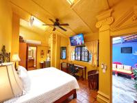 a bedroom with a bed and a living room at Estrellita&#39;s Bed &amp; Breakfast in Ajijic