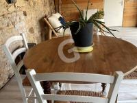 a wooden table with a potted plant on top at Maison Le Bernard, 5 pièces, 6 personnes - FR-1-357-253 in Le Bernard