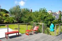 two chairs and a bench on a deck at Superbe maison 4 étoiles pour 8 pers avec piscine sur le port de PERROS-GUIREC - Réf 873 in Perros-Guirec