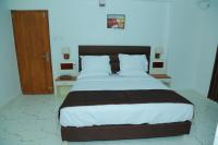 Utsavam Hotel Apartmentsにあるベッド
