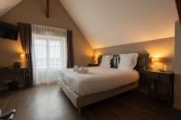 a bedroom with a large bed and a window at Best Western Hotel De La Plage Saint Marc sur Mer in Saint-Nazaire