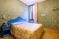 Postel nebo postele na pokoji v ubytování Residenza Ca' San Marco