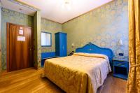 Postel nebo postele na pokoji v ubytování Residenza Ca' San Marco