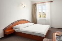 Postel nebo postele na pokoji v ubytování Hotel Adršpach
