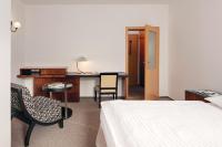 Postel nebo postele na pokoji v ubytování Hotel Adršpach