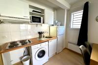 a small kitchen with a washing machine and a sink at E20 Les Naïades- 2 bedrooms for 5 people ! in Avène