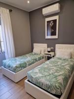 Posteľ alebo postele v izbe v ubytovaní Home K&Y - Aurelio