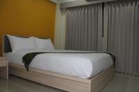 Postel nebo postele na pokoji v ubytování La Porte Hotel Bangkok