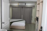 Postel nebo postele na pokoji v ubytování La Porte Hotel Bangkok