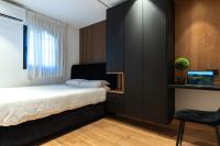 Ein Bett oder Betten in einem Zimmer der Unterkunft סוויטות אוראל 432