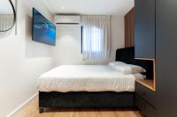 Ein Bett oder Betten in einem Zimmer der Unterkunft סוויטות אוראל 432