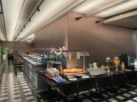 a buffet line in a restaurant with food on display at The Clouds Apartment in Shenzhen