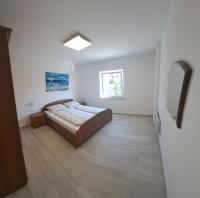 Łóżko lub łóżka w pokoju w obiekcie Apartmani Totić