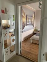 Łóżko lub łóżka w pokoju w obiekcie Sweet-home erkélyes apartman Kaposvár
