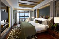 Postel nebo postele na pokoji v ubytování Anantara Riverside Bangkok Resort