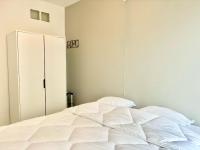 A bed or beds in a room at Phebus 0101 - Vue Mer