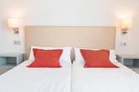 Postel nebo postele na pokoji v ubytování Apartamentos El Palmar