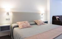 Postel nebo postele na pokoji v ubytování Apartamentos El Palmar