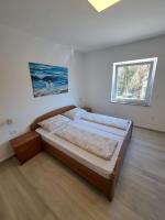 Łóżko lub łóżka w pokoju w obiekcie Apartmani Totić