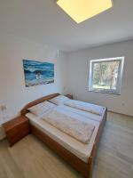 Łóżko lub łóżka w pokoju w obiekcie Apartmani Totić