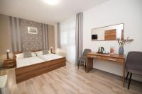 Postel nebo postele na pokoji v ubytování Apartmány u jezera Fami***