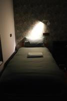 Postel nebo postele na pokoji v ubytování Fountain Hotel