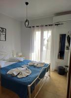 Postel nebo postele na pokoji v ubytování Villa Theo Corfu