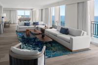 a living room with a couch and a table at San Juan Marriott Resort and Stellaris Casino in San Juan