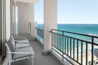 a balcony with chairs and a view of the ocean at San Juan Marriott Resort and Stellaris Casino in San Juan