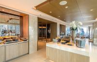 a restaurant with a dessert counter in a building at Eastin Grand Hotel Sathorn in Bangkok
