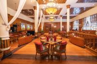 a restaurant with a table and chairs in a building at Ayodya Resort Bali in Nusa Dua