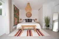 A bed or beds in a room at Caballito de Mar Boutique Hotel